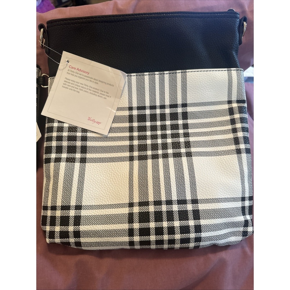 Thirty-One organizing shoulder bag features a black and white buffalo check